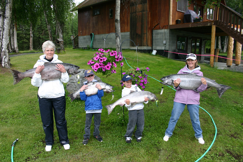 Kids With Big King Salmon In Alaska